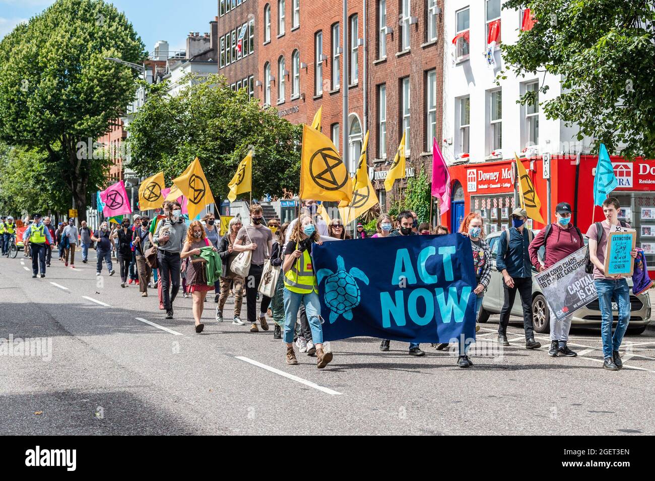 Cork, Ireland. 21st Aug, 2021. A small group of approx. 60 Extinction Rebellion protestors assembled on the Grand Parade today to highlight the need for 'immediate and fair action for carbon neutrality'. After a number of speeches, the group marched down the South Mall and up Patrick Street before breaking into discussion groups back at Grand Parade. Credit: AG News/Alamy Live News Stock Photo