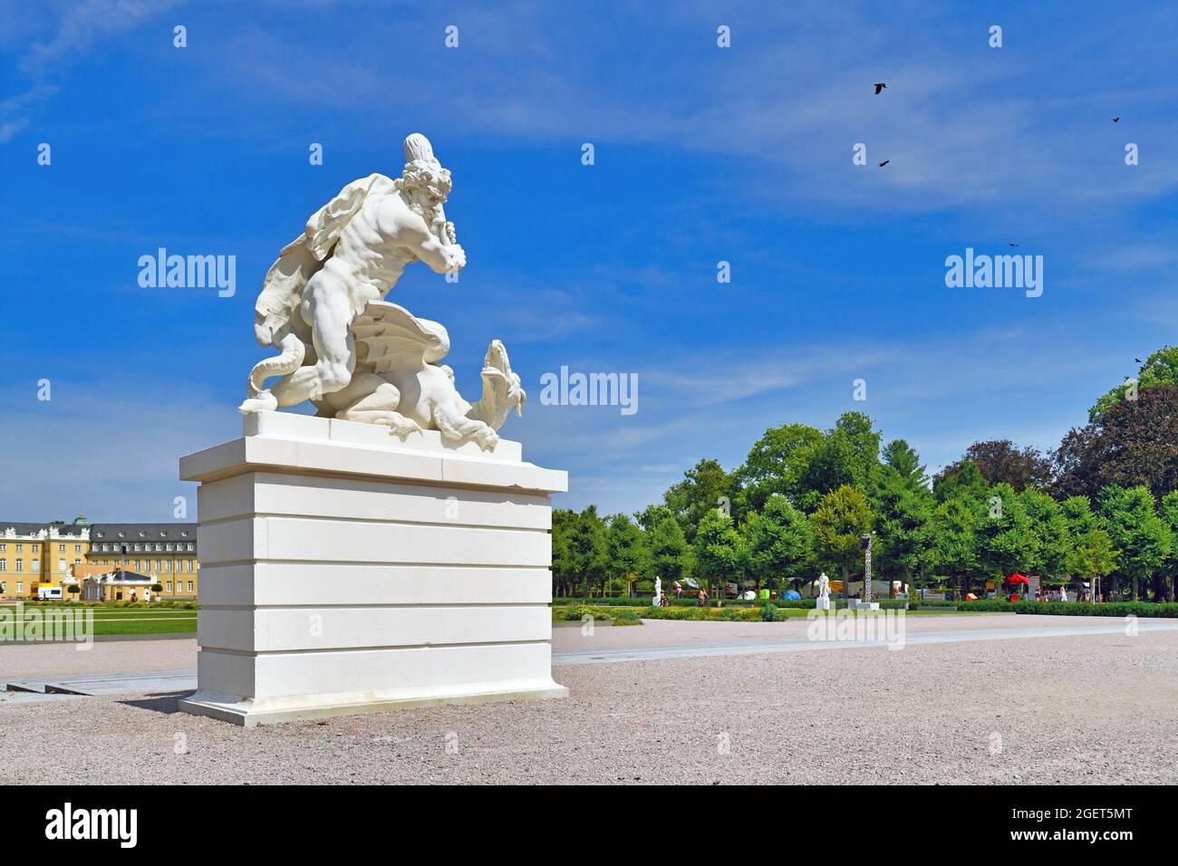 Karlsruhe, Germany - August 2021: Sculpture of Hercules slaying dragon Ladon in front of palace garden Stock Photo
