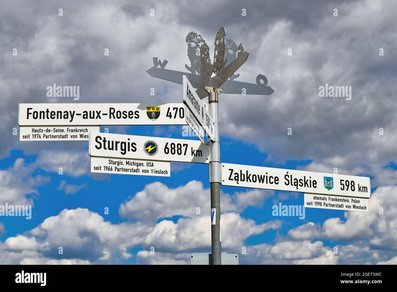 Wiesloch, Germany - August 2021: Road sign showing direction and distance  to twin cities of Wiesloch in France and Poland Stock Photo - Alamy