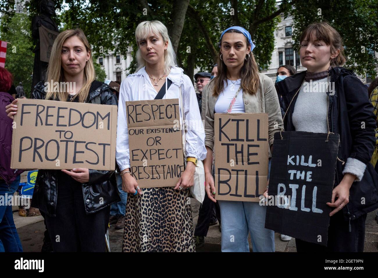 London, UK.  21 August 2021. Women with signs at a Kill the Bill protest in Parliament Square where people are campaigning against the Police, Crime, Sentencing and Courts Bill Government Bill.  Members of climate activists Extinction Rebellion (XR) are also present ahead of reported climate protests targeting the City of London next week.  Credit: Stephen Chung / Alamy Live News Stock Photo