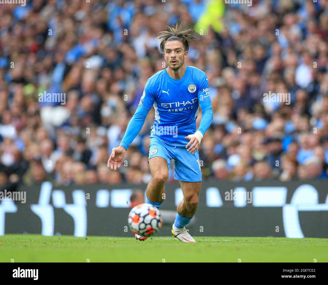 Jack Grealish #10 of Manchester City runs with the ball