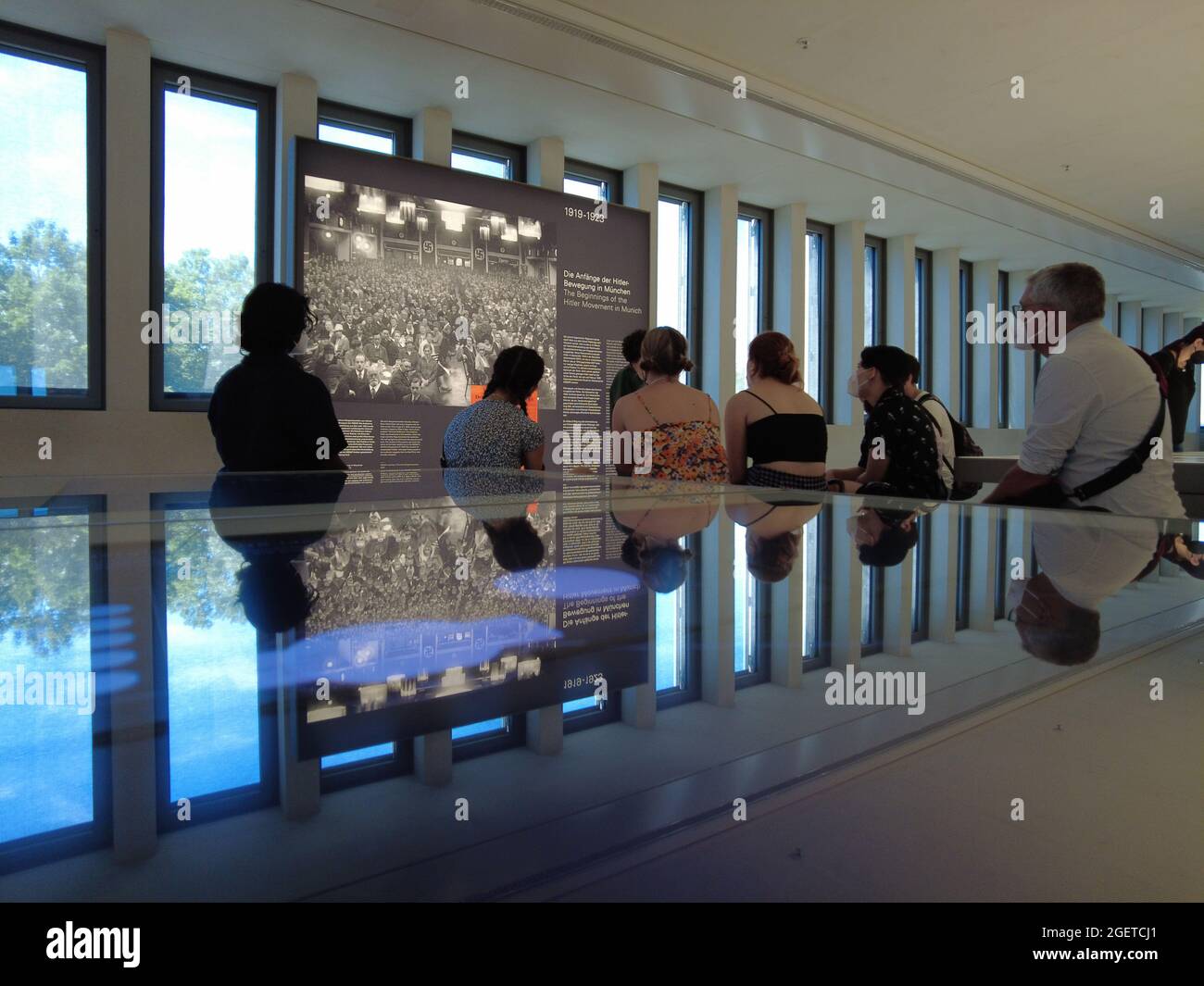 Tourists learning holocaust, Documentation Centre for history of National Socialism Stock Photo