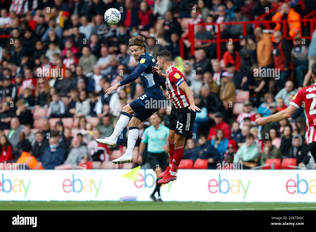 Danny Ward #25 of Huddersfield Town and John Egan #12 of Sheffield United Stock Photo