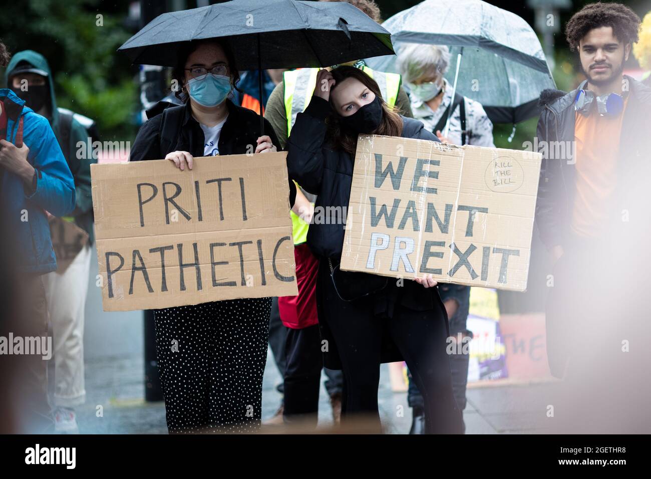 Manchester, UK. 21st Aug, 2021. Protesters with placards stand outside the Civil Justice Centre. Protests across the country have been organised due to the proposed Police, Crime and Sentencing Bill that, if passed, would introduce new legislation around demonstrations. Credit: Andy Barton/Alamy Live News Stock Photo