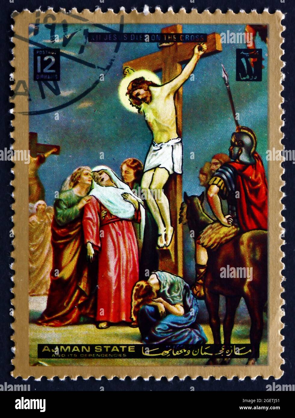 AJMAN - CIRCA 1973: a stamp printed in the Ajman shows Jesus on the Cross, Easter, Stations of the Cross, circa 1973 Stock Photo
