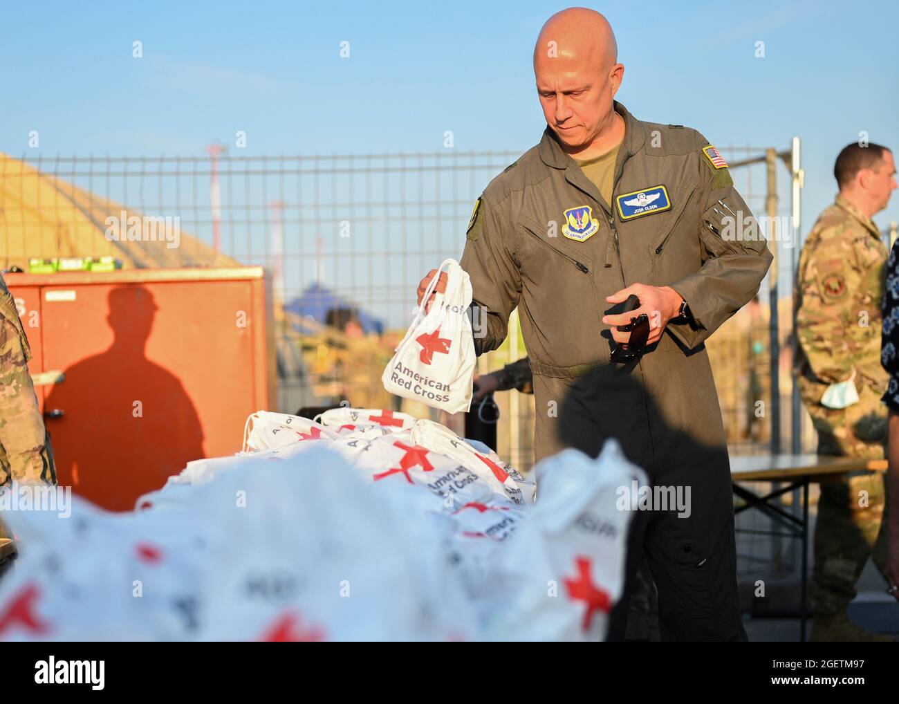 Ramstein Miesenbach, Germany. 20th Aug, 2021. U.S. Air Force Brig. Gen. Josh Olson, 86th Airlift Wing commander, inspects a Red Cross comfort kit for Afghan evacuees at Ramstein Air Base August 20, 2021 in Ramstein-Miesenbach, Germany. Ramstein Air Base is providing temporary lodging for evacuees from Afghanistan as part of Operation Allies Refuge. Credit: Planetpix/Alamy Live News Stock Photo