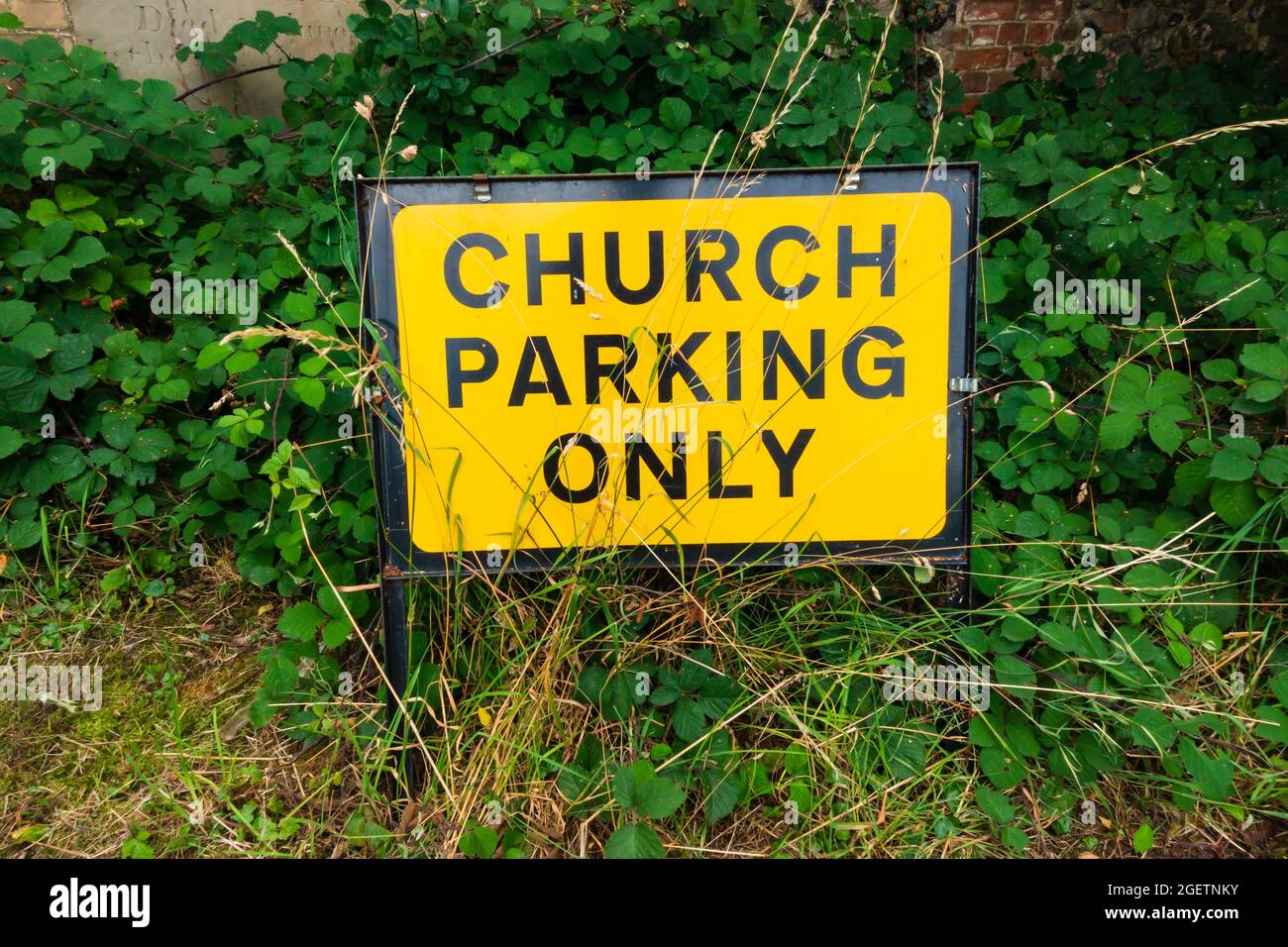 Church Parking Only sign in grass. St Mary's Church. Bury St edmunds, Suffolk, England Stock Photo