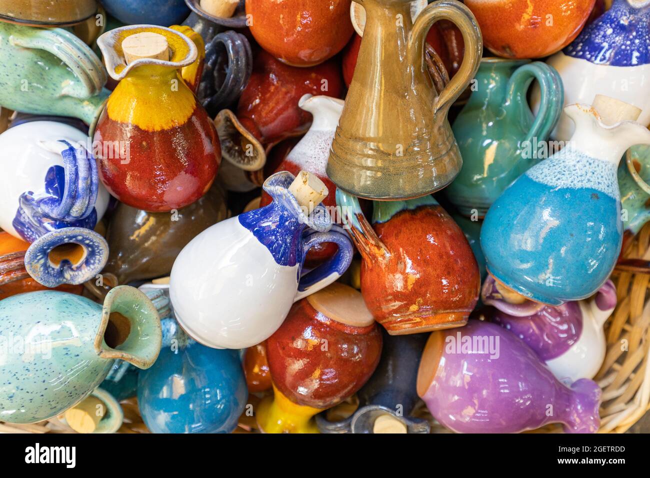 Mediterranean style ceramic oil jugs, background Stock Photo Alamy