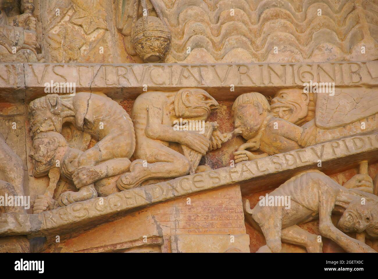 Last Judgment carving showing tortures and punishments of Hell,  from the 13th century, Abbey Church of St. Foy, Conques, France Stock Photo