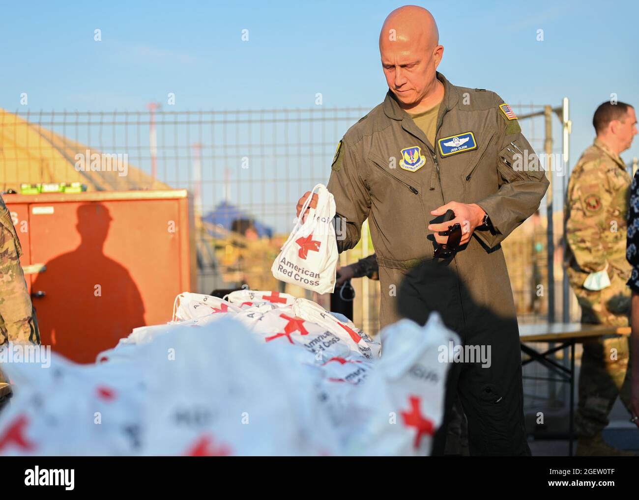 U.S. Air Force Brig. Gen. Josh Olson, 86th Airlift Wing commander, holds a comfort kit provided by the American Red Cross at Ramstein Air Base, Germany, Aug. 20, 2021. Ramstein Air Base is providing safe, temporary lodging for qualified evacuees from Afghanistan as part of Operation Allies Refuge during the next several weeks. Operation Allies Refuge is facilitating the quick, safe evacuation of U.S. citizens, Special Immigrant Visa applicants and other at-risk Afghans from Afghanistan. Qualified evacuees will receive support, such as temporary lodging, food, medical screening and treatment an Stock Photo