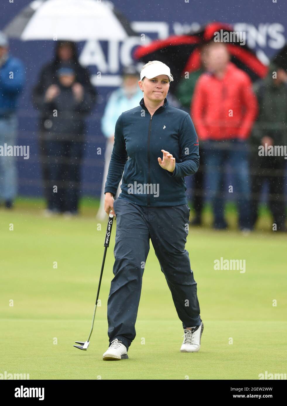 Denmark's Nanna Koerstz Madsen acknowledges the crowd after finishing on the 18th green during day three of the AIG Women's Open at Carnoustie. Picture date: Saturday August 21, 2021. See PA story GOLF Women. Photo credit should read: Ian Rutherford/PA Wire. RESTRICTIONS: Use subject to restrictions. Editorial use only, no commercial use without prior consent from rights holder. Stock Photo