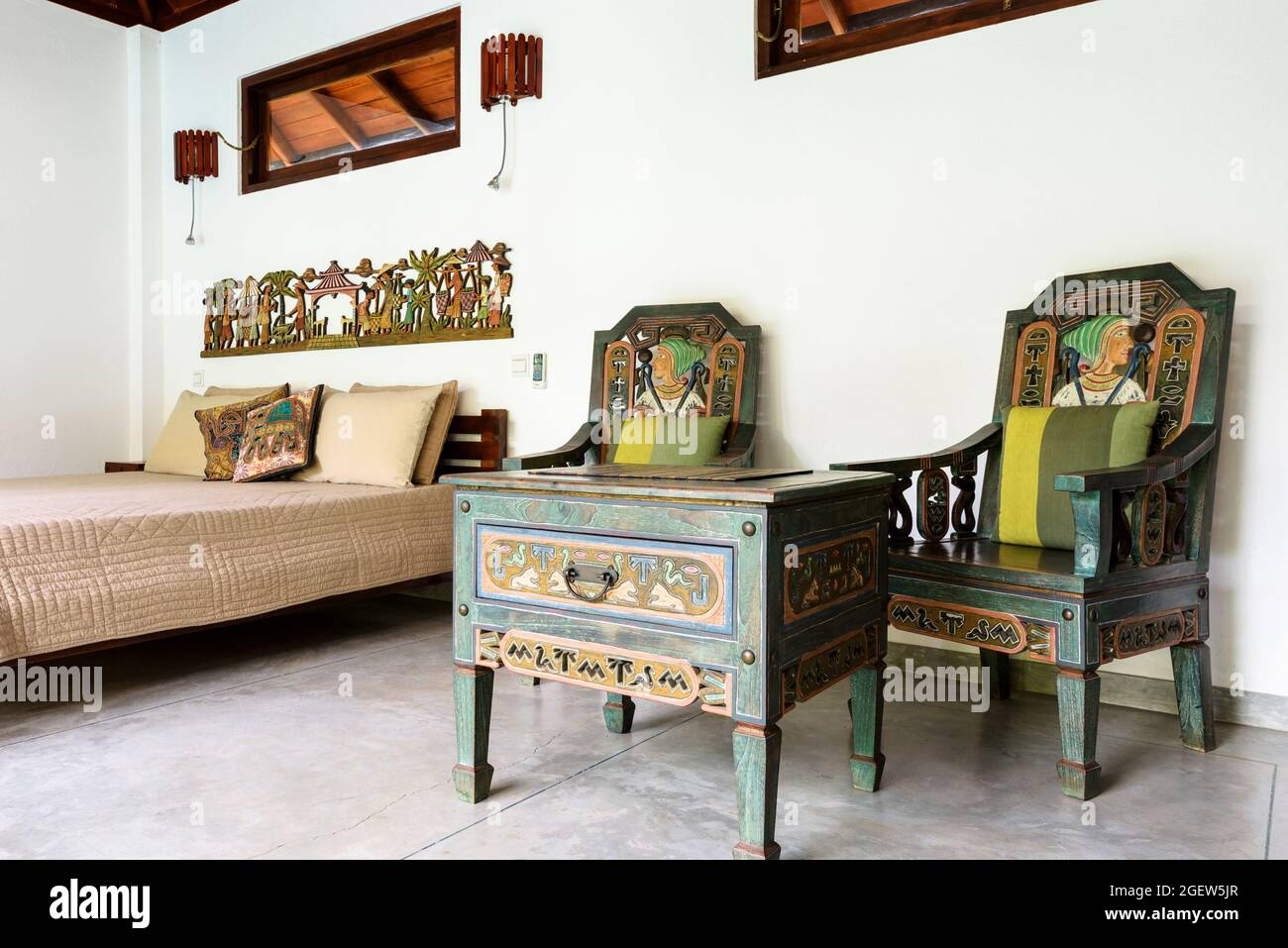 Tangalle, Sri Lanka - Oct 31, 2017: Inside hotel or residential house, room with bed and wooden furniture in ethnic style. Bedroom home interior in In Stock Photo