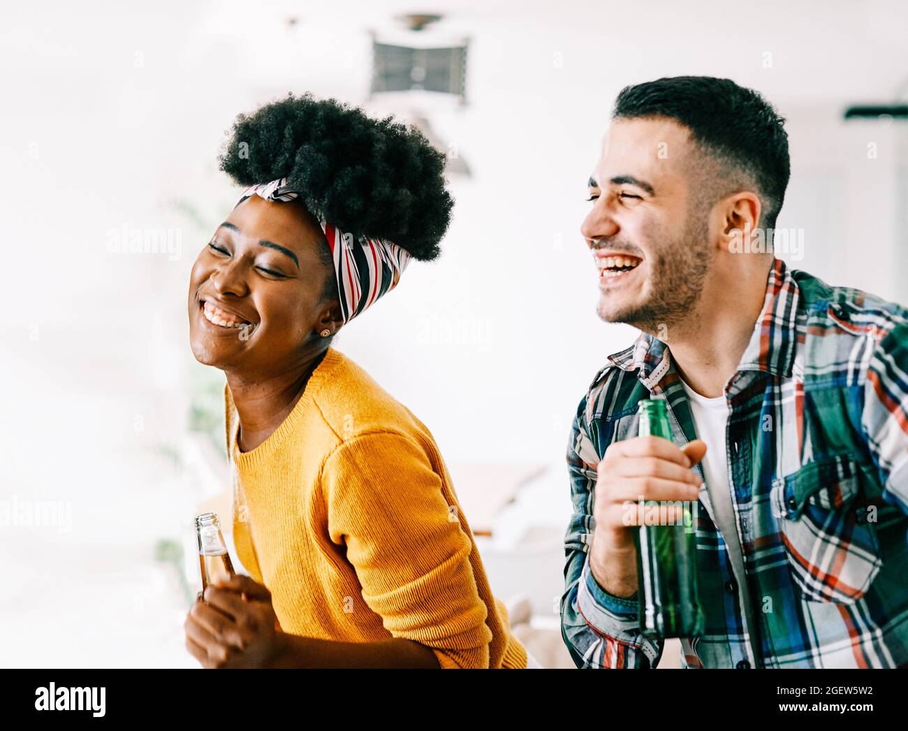 girl boy couple party dancing drinking beer bottle fun friend Stock Photo