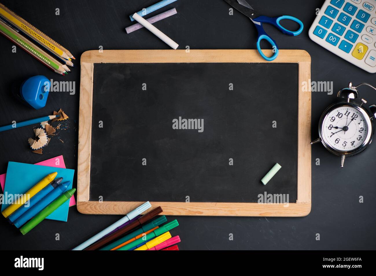 A blackboard on wood background with School supplies top view Stock ...