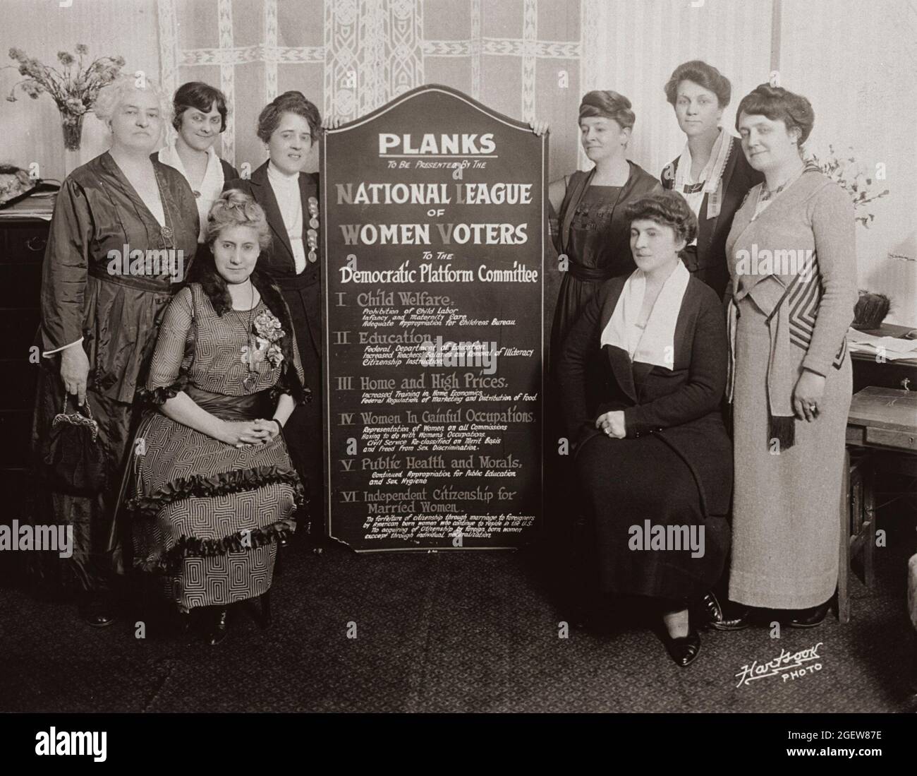 Pattie Ruffner Jacobs (left) and Maud Wood Park (right) holding a sign listing the planks to be presented by the NLWV to the Democratic Platform Committee, June 1920. Stock Photo