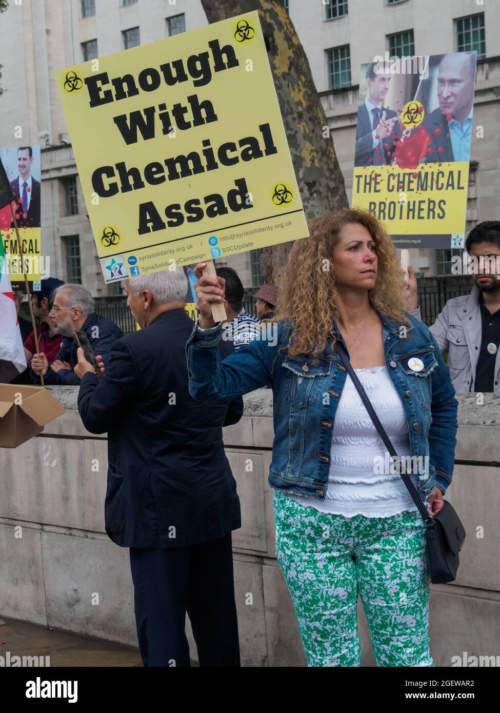 London, UK. 21st August 2921. Syrians came to Downing St on the 8th  anniversary to demand justice for the victims of the Ghouta chemical  massacre, in which 1477 civilians were gassed to