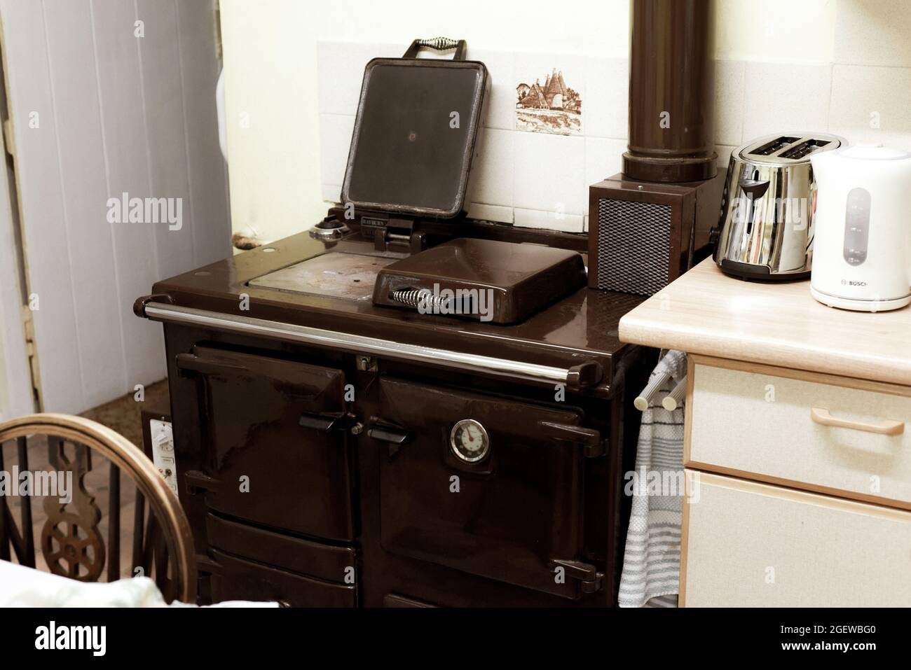 Old style oil burning stove in retro kitchen interior Stock Photo Alamy