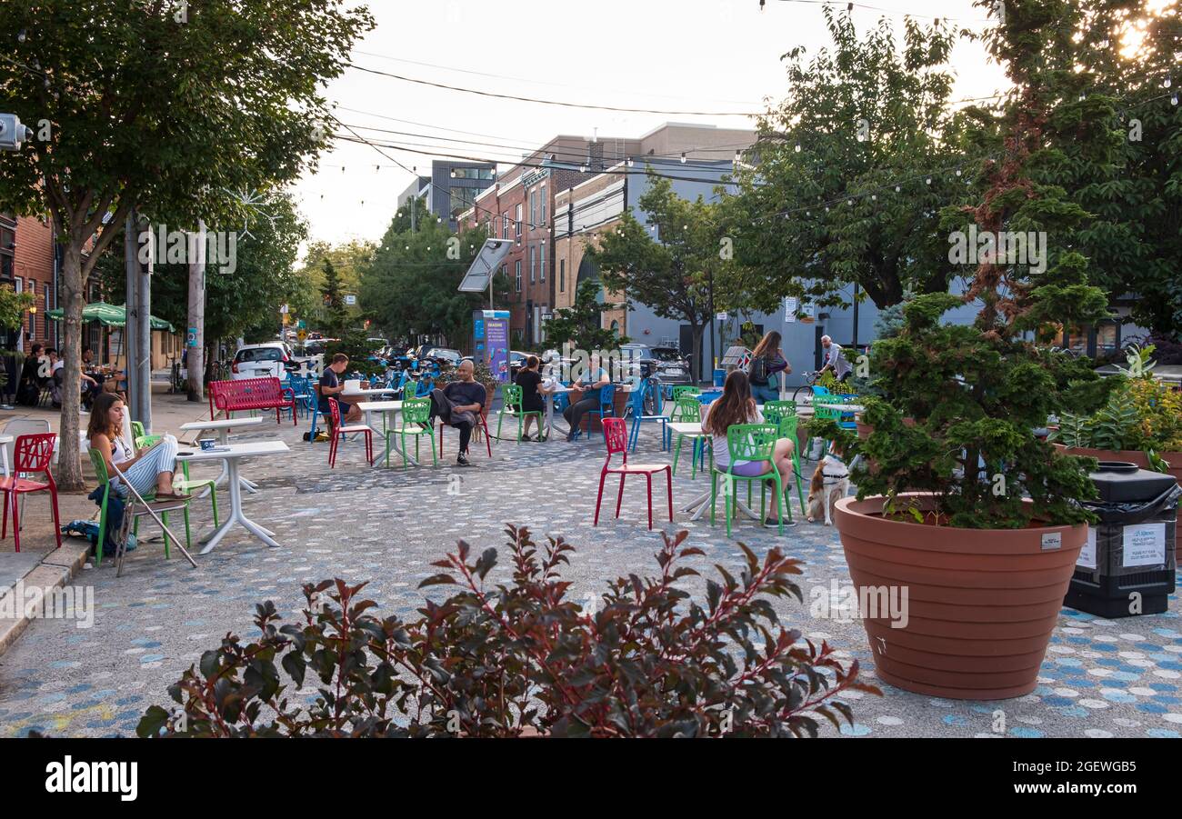 Park made in former street space surrounded by retail and cafes, Graduate Hospital area, South Philadelphia, Pennsylvania, USA Stock Photo