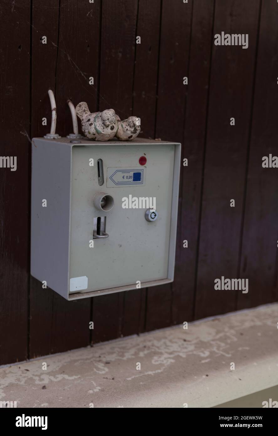 old coin machine at water tap Stock Photo - Alamy