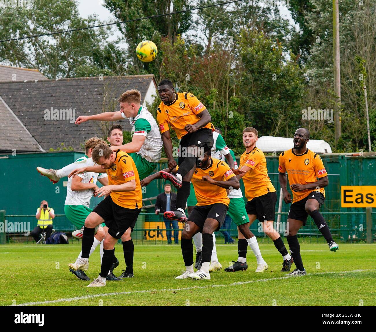 Isthmian Premier League soccer match, Bognor Regis Town Football Club versus East Thurrock. A bunch of players leap into the air to head the ball Stock Photo