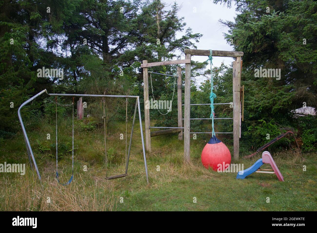 Old, neglected playground, not used for a long time Stock Photo