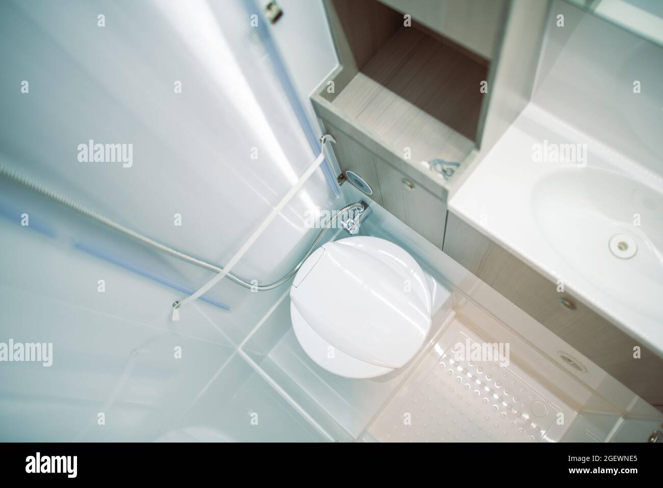 Narrow Clean and Modern Camper Van Class B RV Bathroom with Toilet