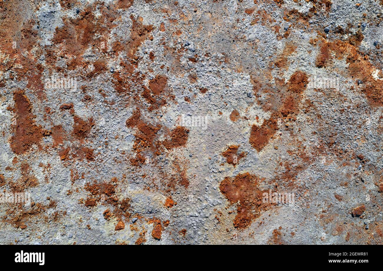 Grey stone texture with spots of rust, abandoned industrial background Stock Photo