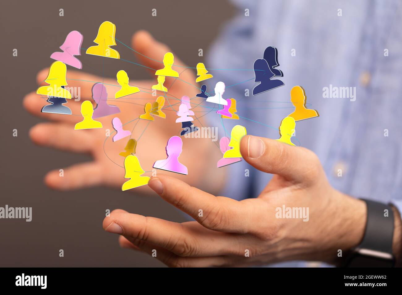 3D rendered people silhouettes held in a person's hand Stock Photo - Alamy