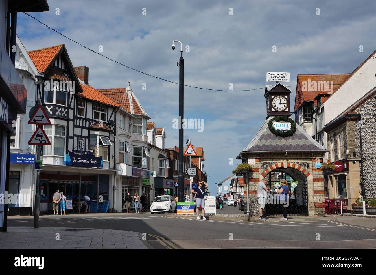 The town centre in Sheringham with the old clock shelter built in 1862 Stock Photo