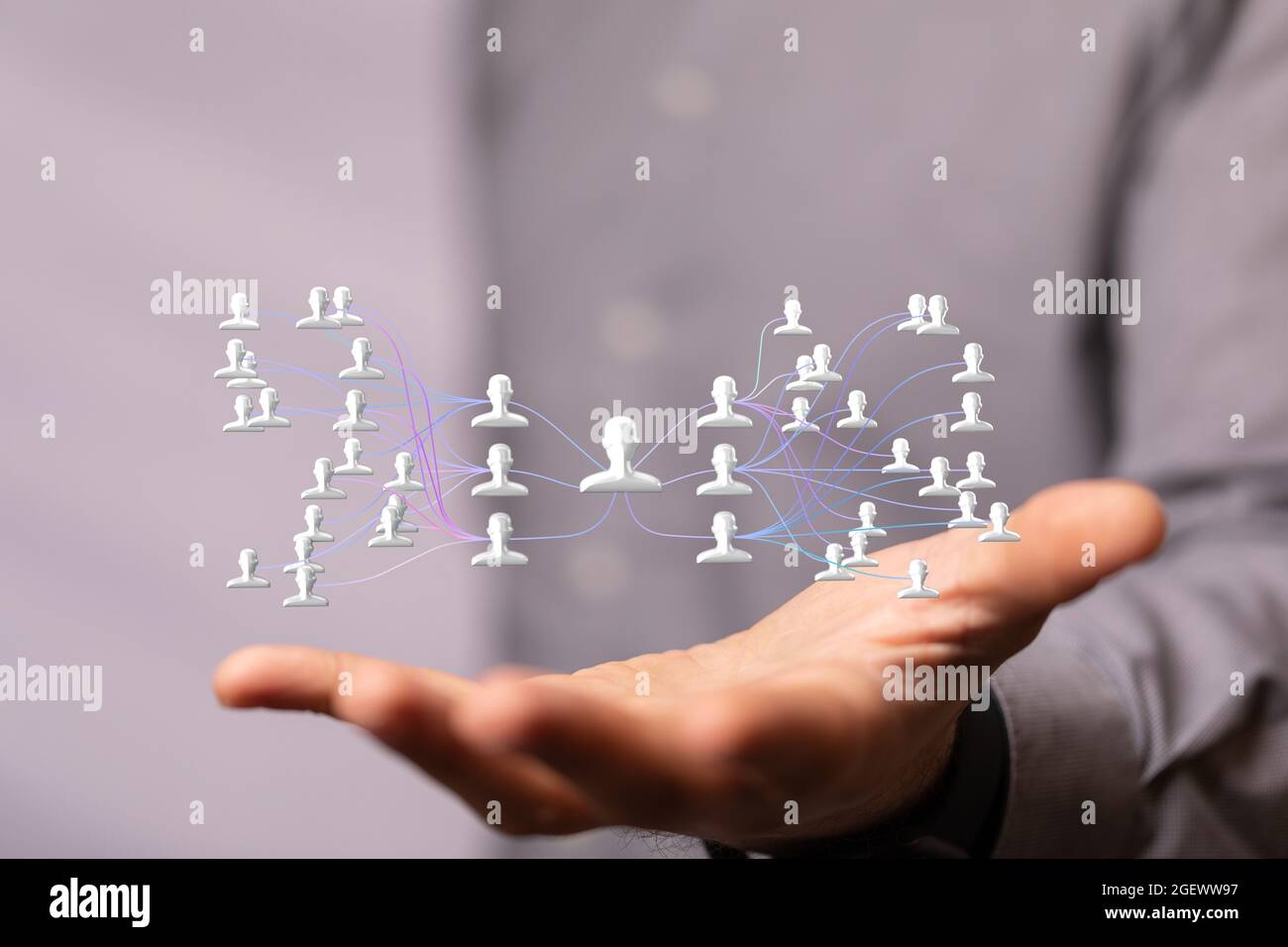3D rendered people silhouettes held in a person's hand Stock Photo - Alamy