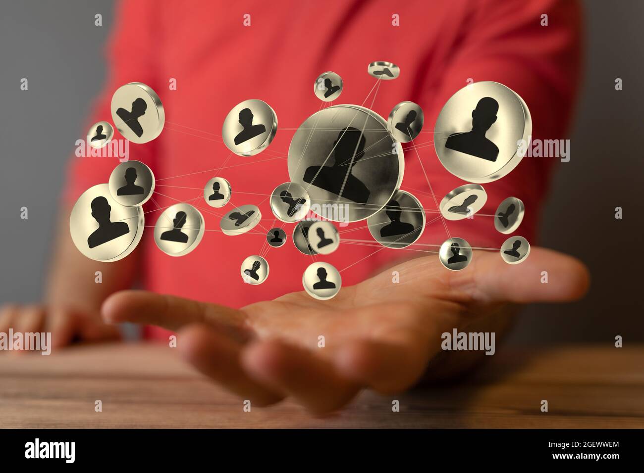 3D rendered people silhouettes held in a person's hand Stock Photo - Alamy
