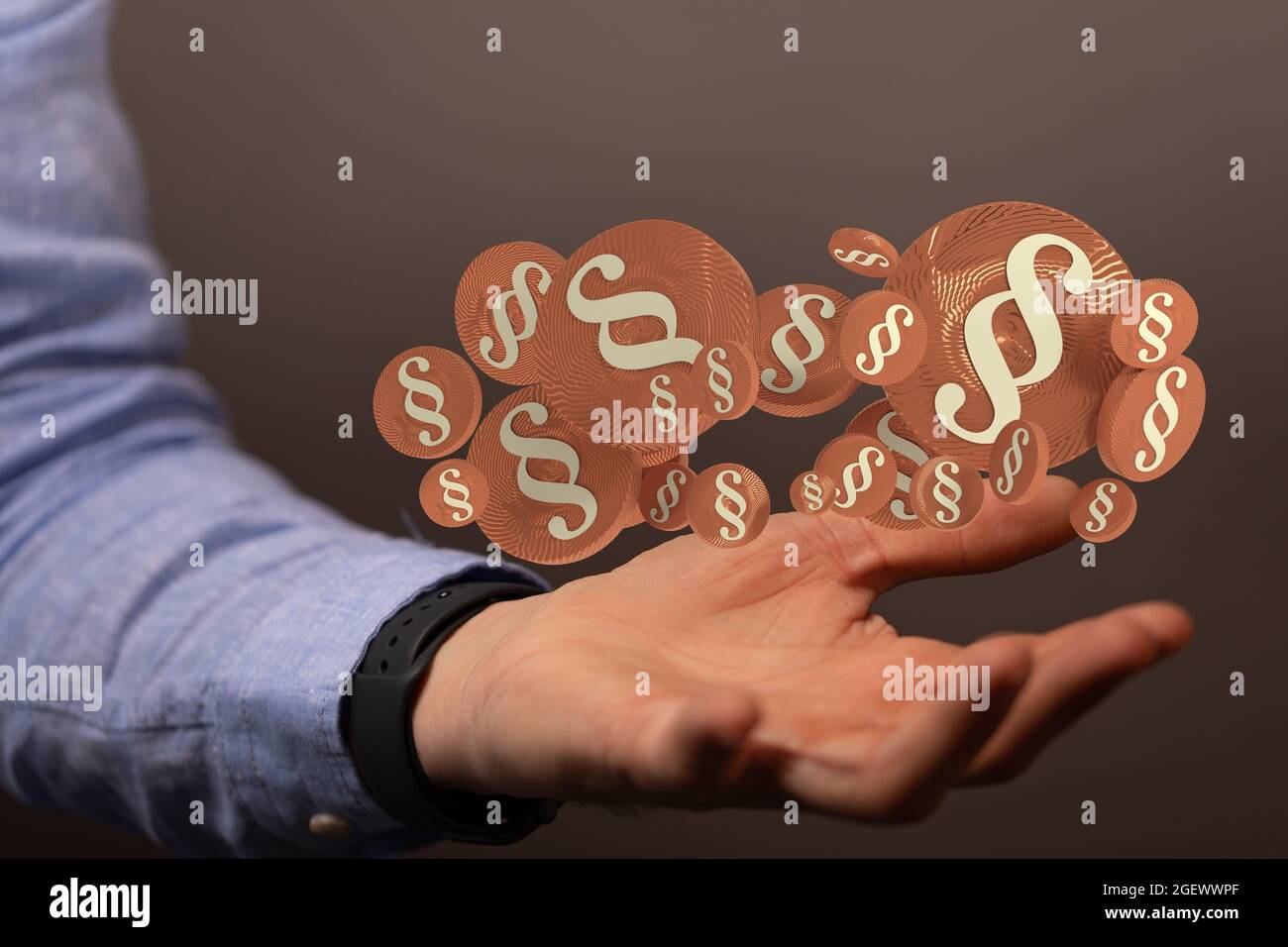 Digital concept of law and justice with floating law symbols on a hand ...