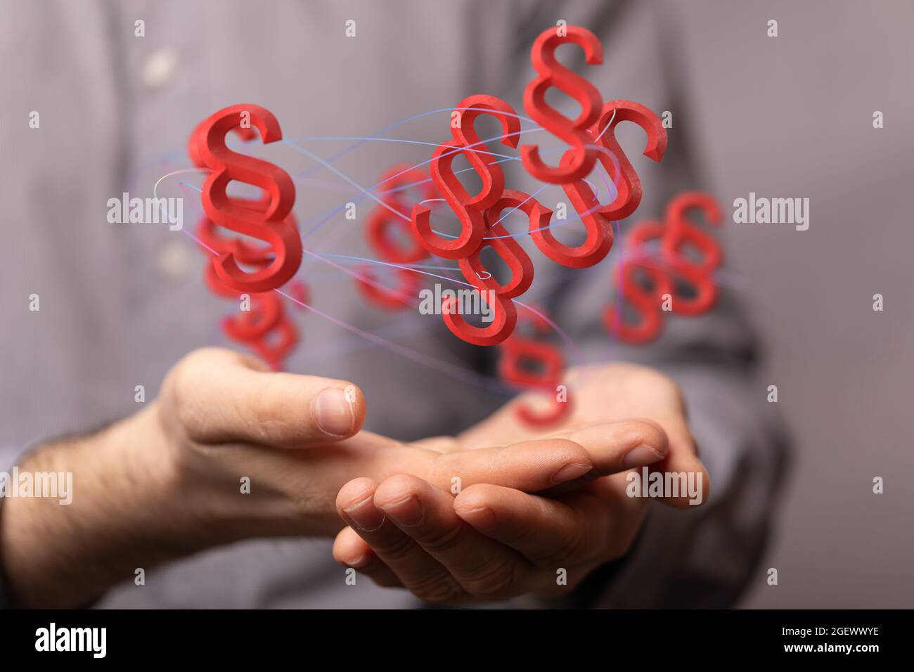 Digital concept of law and justice with floating law symbols on a hand ...
