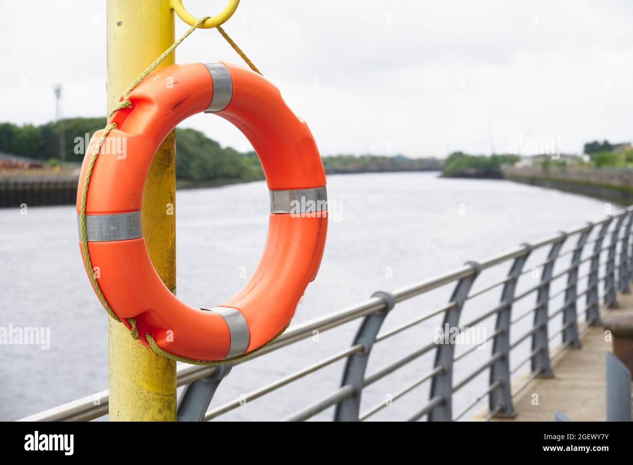 Red buoy life safety ring attach esplanade Stock Photo Alamy