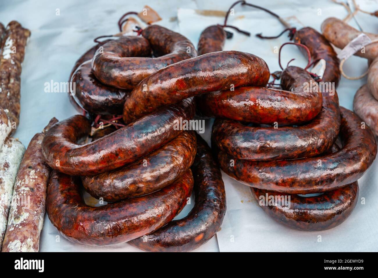 Typical Spanish sausages lying on a village stall at the food market