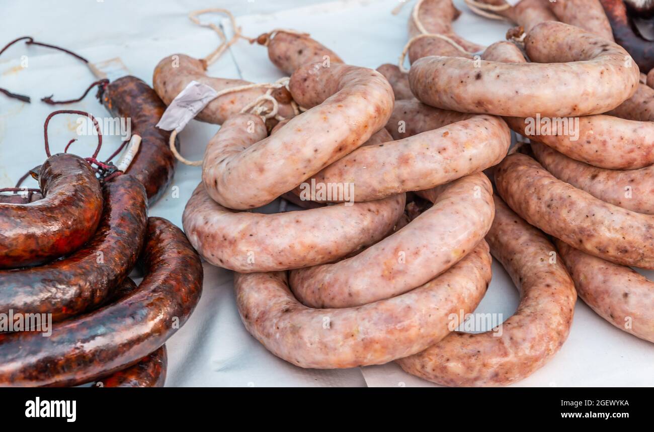 Typical Spanish sausages lying on a village stall at the food market