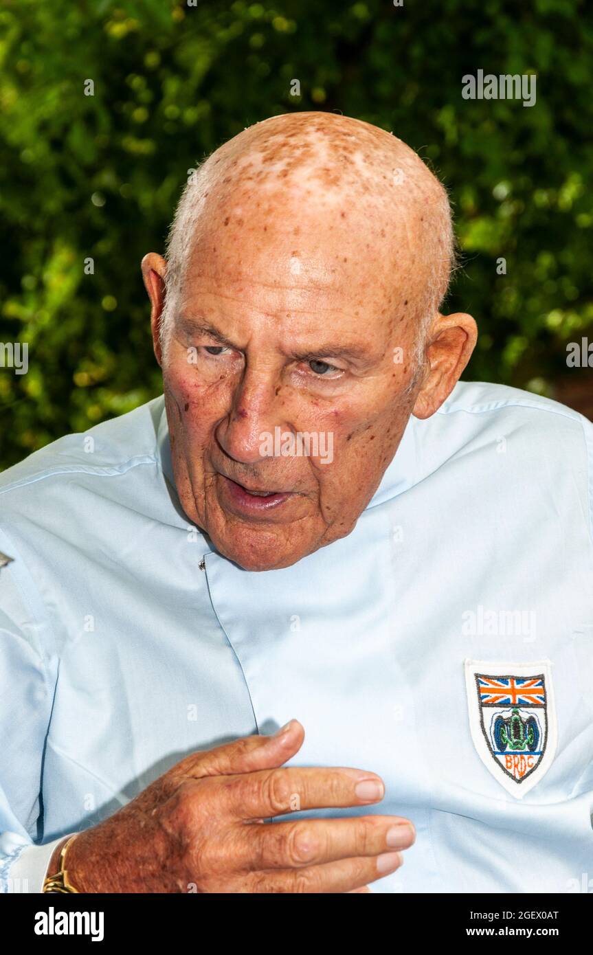 Stirling Moss. Legendary Formula 1, Grand Prix racing driver at the Goodwood Festival of Speed 2014 in British light blue overalls with BRDC badge Stock Photo