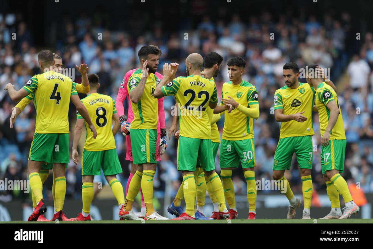 21st August 2021; Manchester City Stadium, Manchester, England, Premier League football, Manchester City versus Norwich; the Norwich players shake hands prior to the kick off Stock Photo