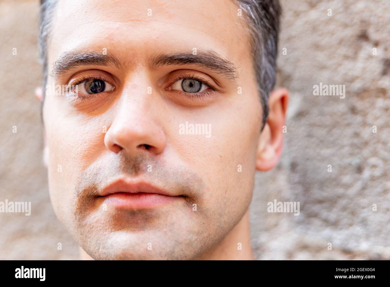 Close up portrait of latin man with heterochromia Stock Photo