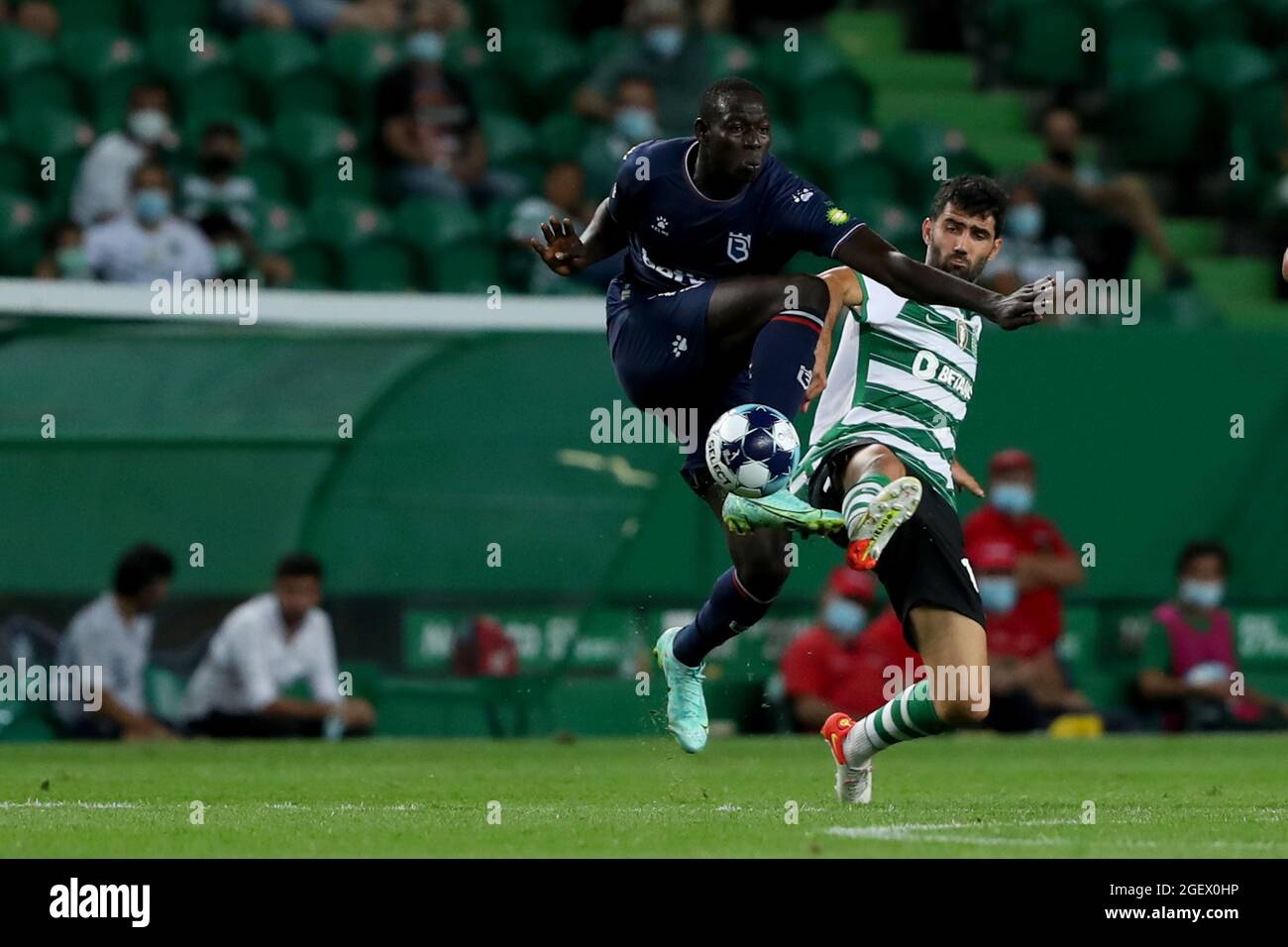 Lisbon, Portugal. 21st Aug, 2021. Alioune Ndour of Belenenses SAD (L) vies with Luis Neto of Sporting CP during the Portuguese League football match between Sporting CP and Belenenses SAD at Jose Alvalade stadium in Lisbon, Portugal on August 21, 2021. (Credit Image: © Pedro Fiuza/ZUMA Press Wire) Stock Photo