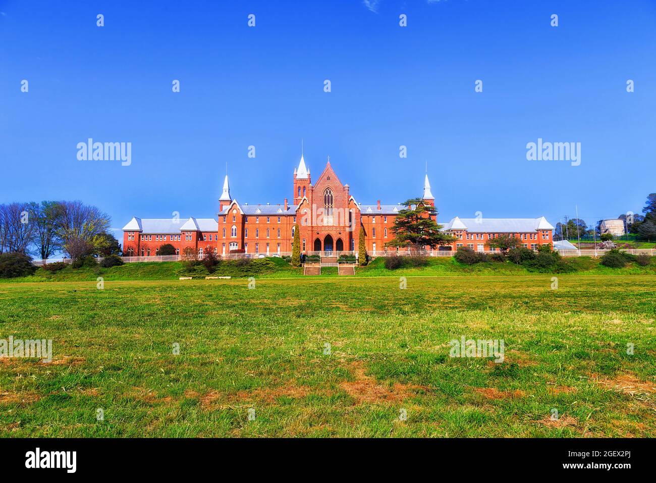 Red brick facade and main building of local high-school college in rural town of Australia - Bathurst. Stock Photo