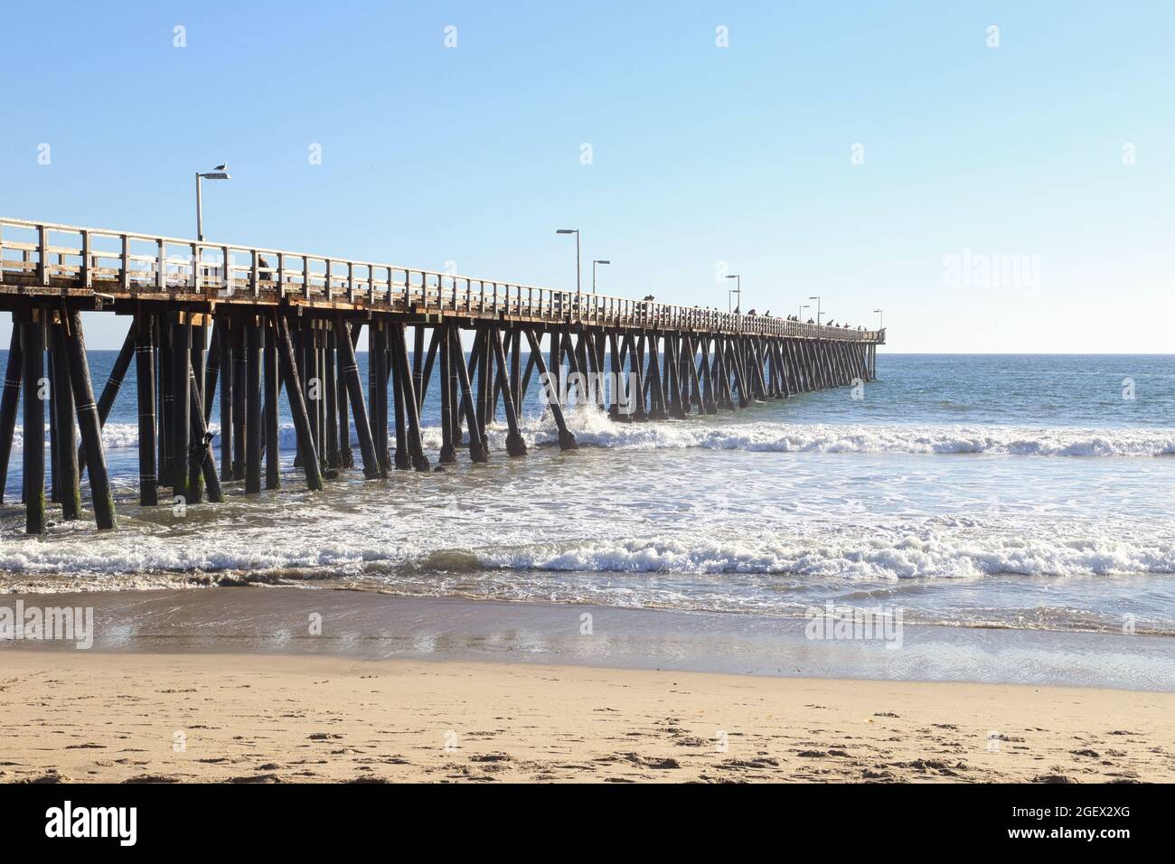 The Port Hueneme Fishing Pier, which is located along the California coast, north of Los Angeles, is shown during the day. Stock Photo