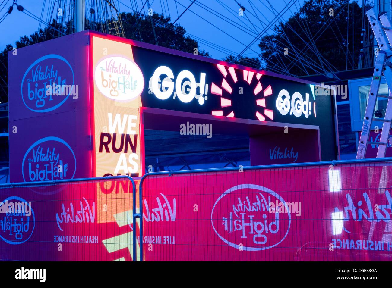 GO GO sign lit up on LED screen at the finishing line of BIG Half Marathon UK 2021 Stock Photo