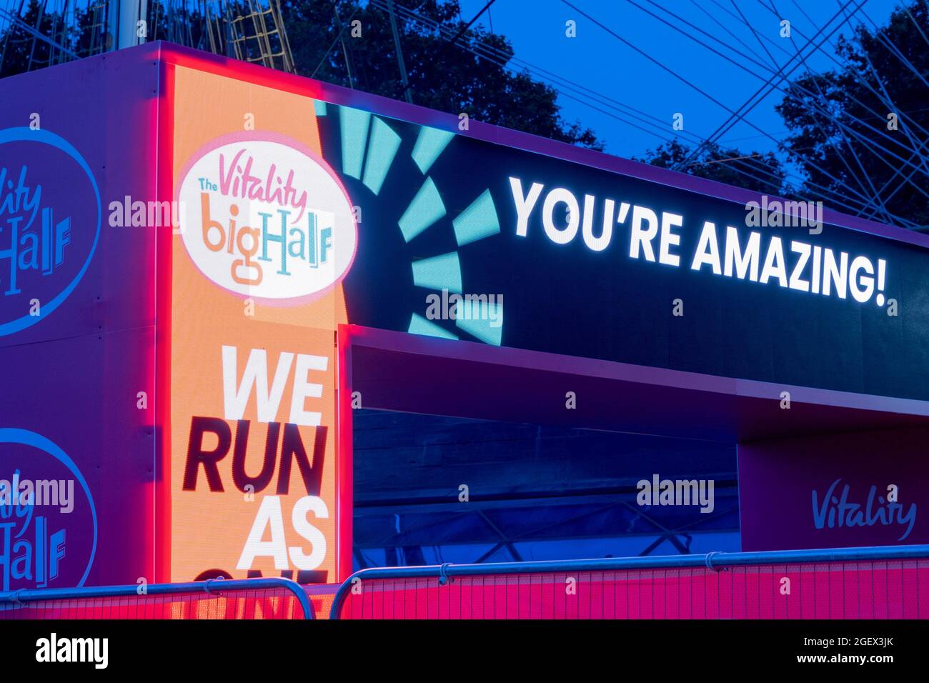 YOU'RE AMAZIN message displayed on LED screen at the finishing line of BIG Half Marathon UK 2021 Stock Photo