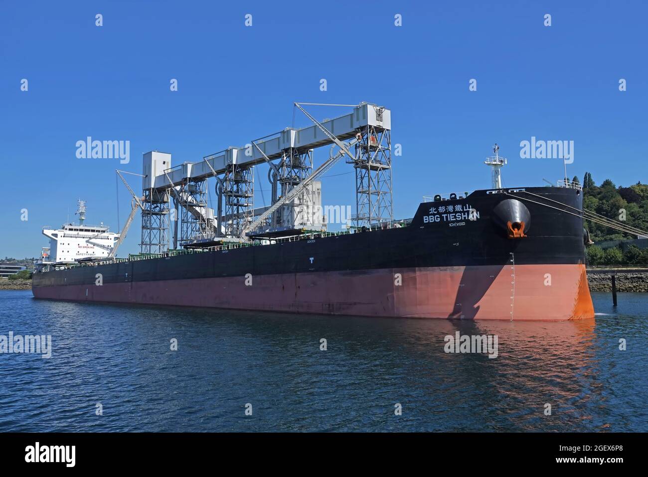 Seattle, WA / USA - June 25, 2021: The maritime dry bulk ship BBG Tieshan, which operates under the Hong Kong flag, is shown anchored. Stock Photo