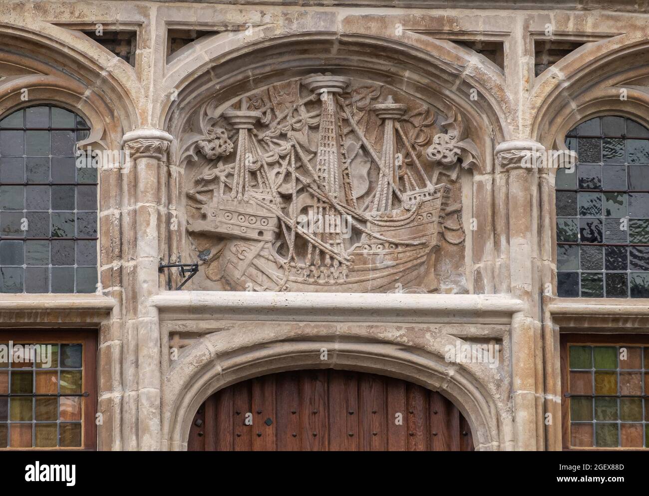 Gent, Flanders, Belgium - July 30, 2021: Closeup of fresco showing large medieval sailing ship above door of House of the free Shippers (Huis van de V Stock Photo