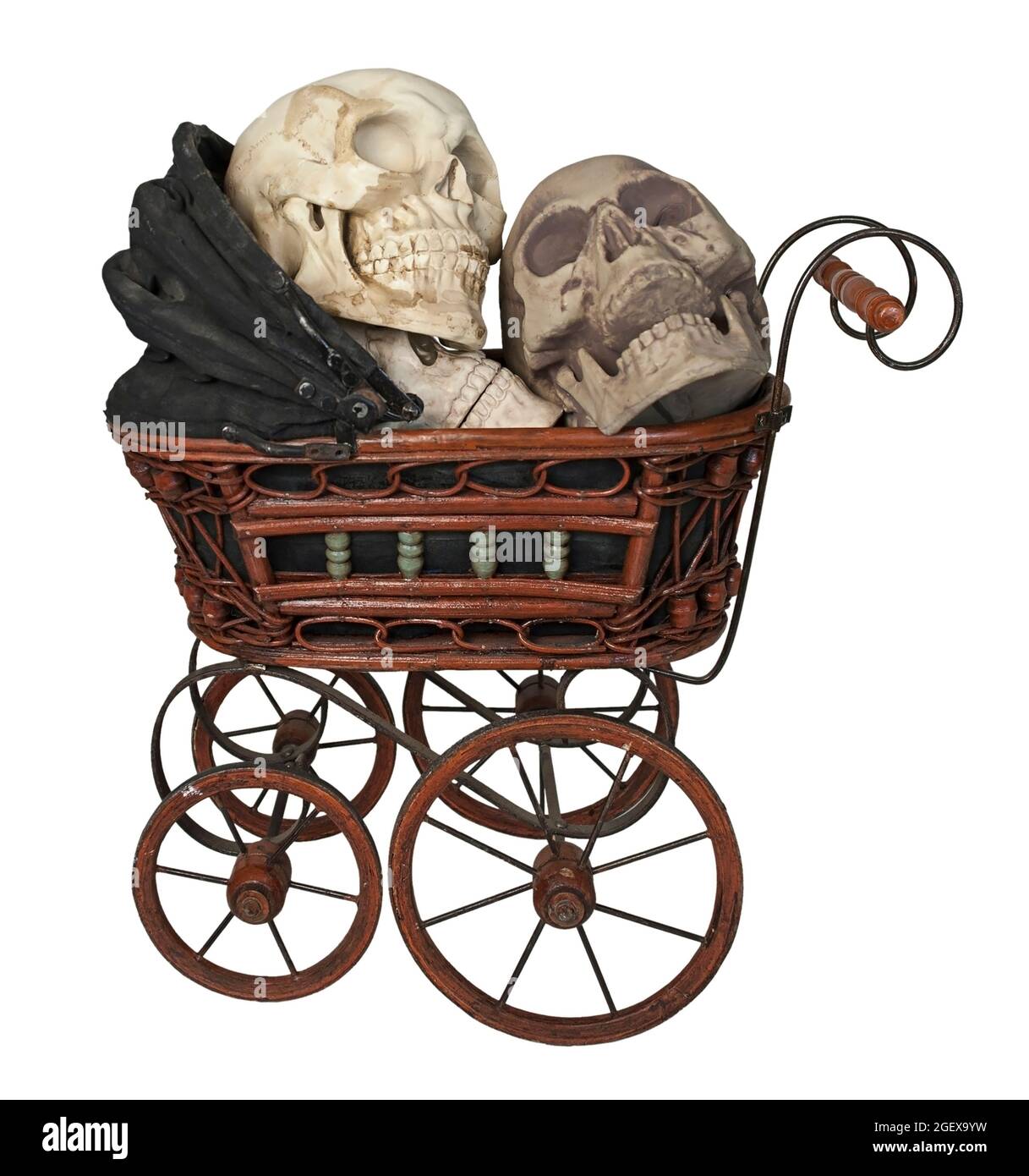 Black Bassinet full of Skulls with eye sockets and teeth - path included Stock Photo