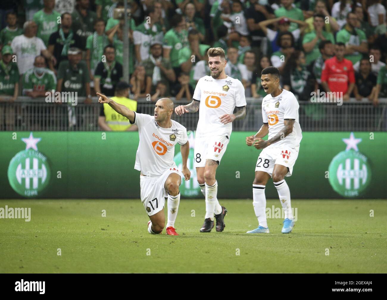 Burak Yilmaz of Lille celebrates his goal with Xeka and Reinildo Mandava  during the French championship Ligue 1 football match between AS  Saint-Etienne (ASSE) and Lille OSC (LOSC) on August 21, 2021