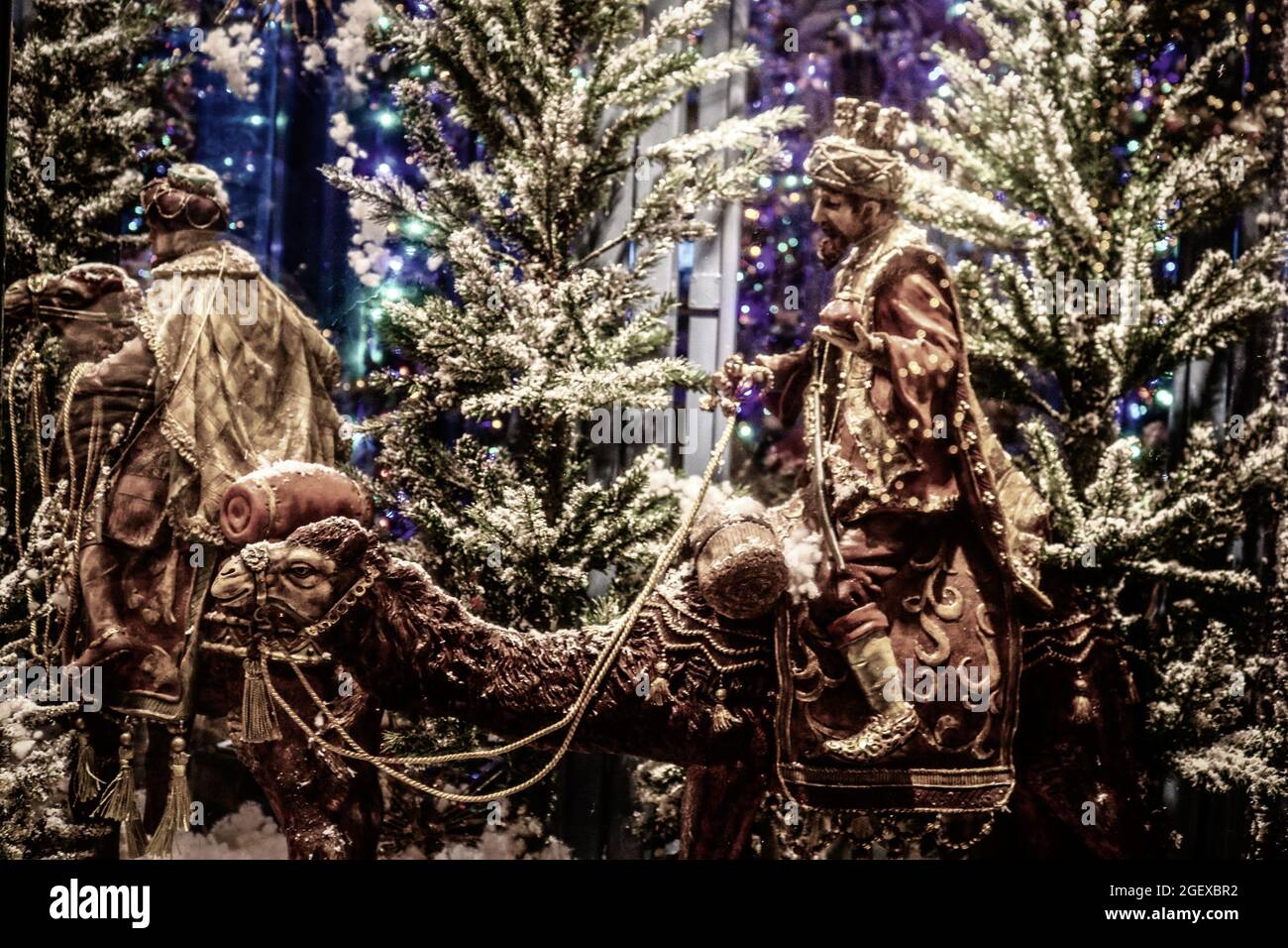 2018_01_03_Athens Greece -Biblical  Christmas commerical display of wise men on cammels in front of trees and holiday nights. Stock Photo