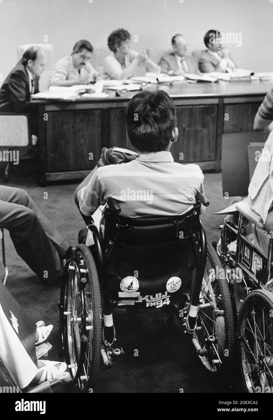 Austin Texas USA, circa 1990: Handicapped citizens in wheelchairs attend meeting of city transportation board to advocate for accessibility. Stock Photo